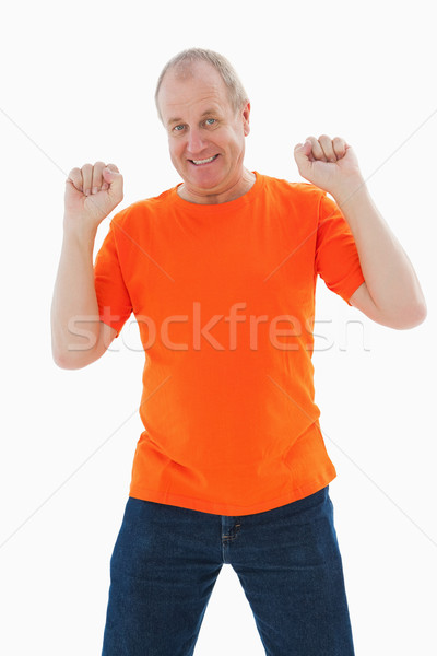 Stockfoto: Volwassen · man · oranje · tshirt · juichen · witte · portret