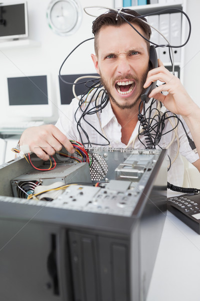 Angry computer engineer making a call Stock photo © wavebreak_media