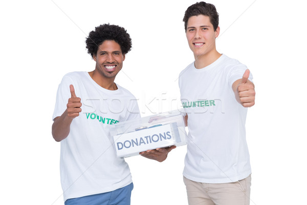 Foto stock: Jovem · sorridente · voluntários · doações · branco