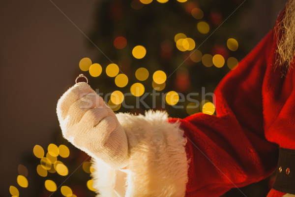 Hand of santa claus holding engagement ring Stock photo © wavebreak_media