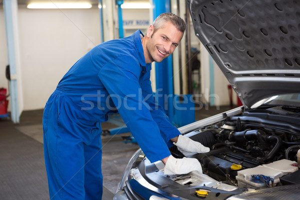 Mechanic examining under hood of car Stock photo © wavebreak_media