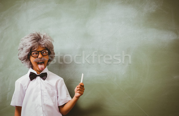 Boy dressed as senior teacher in front of blackboard Stock photo © wavebreak_media