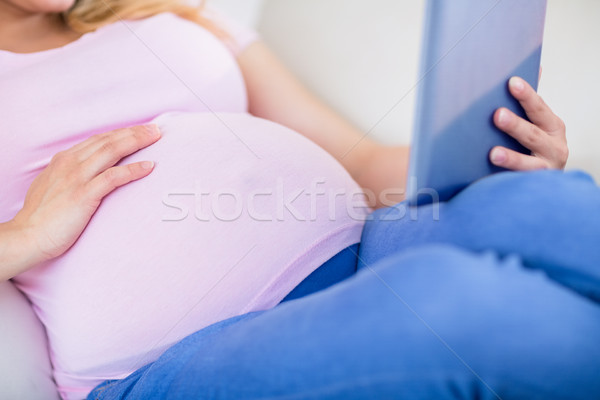 Close up of pregnant woman using tablet Stock photo © wavebreak_media