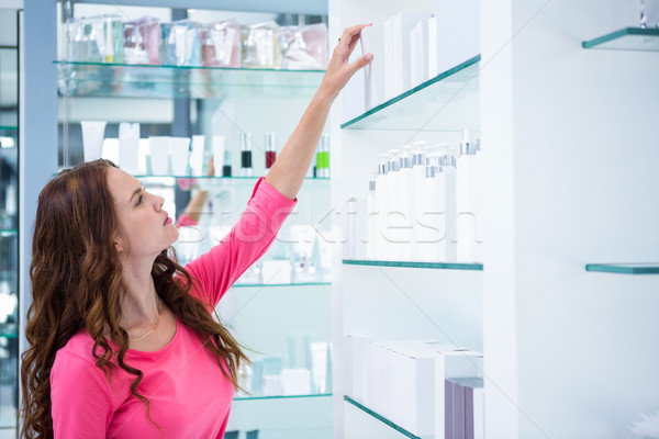 Pretty woman shopping for cosmetics Stock photo © wavebreak_media