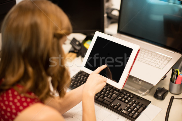 Businesswoman using digital tablet at office desk Stock photo © wavebreak_media