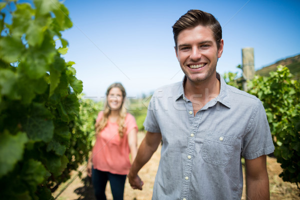 Happy young man holding woman hand at vineyard Stock photo © wavebreak_media