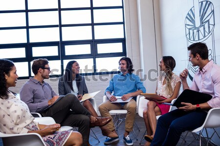 Group of friends interacting with each other Stock photo © wavebreak_media