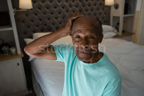 Portré mosolyog idős férfi ül otthon Stock fotó © wavebreak_media