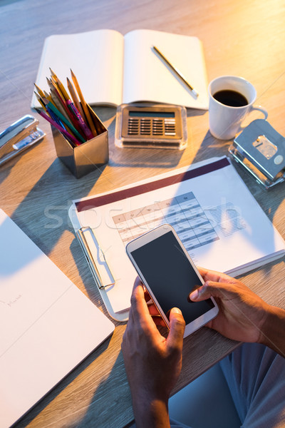 Homme exécutif téléphone portable bureau bureau main [[stock_photo]] © wavebreak_media