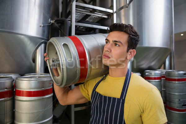 Worker looking away while carrying keg Stock photo © wavebreak_media