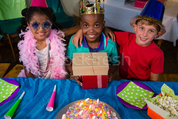 High angle portrait of smiling friends with arms crossed at table Stock photo © wavebreak_media