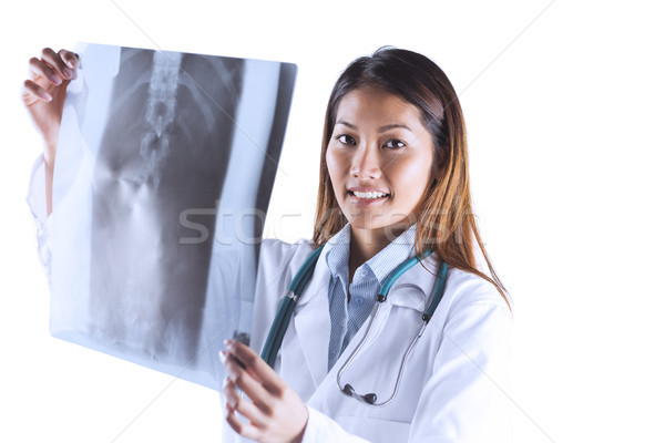 Asian doctor checking MRI scan Stock photo © wavebreak_media