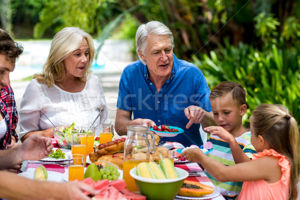 Déjeuner famille heureux amour homme été [[stock_photo]] © wavebreak_media