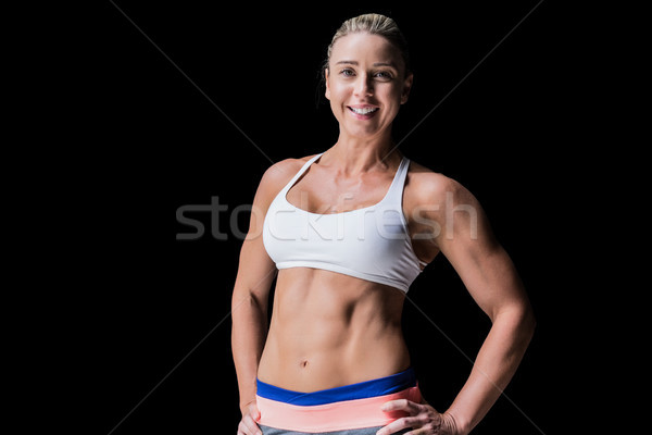 Feminino atleta posando mãos quadril preto Foto stock © wavebreak_media