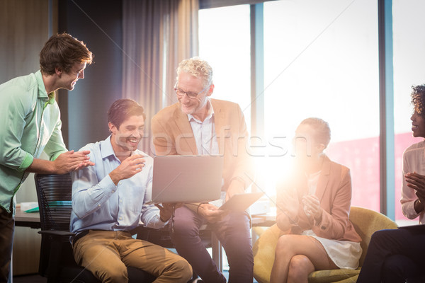 Business people discussing over laptop Stock photo © wavebreak_media