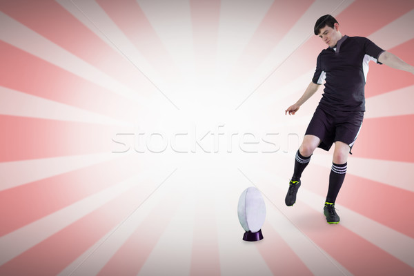 Composite image of rugby player doing a drop kick Stock photo © wavebreak_media