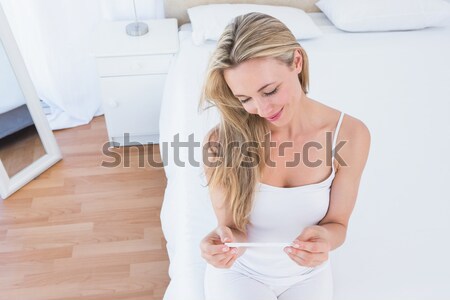 Radiant young woman reading a book  Stock photo © wavebreak_media