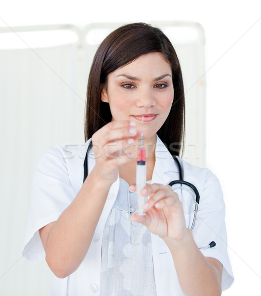 Portrait of a cute female doctor preparing a syringe Stock photo © wavebreak_media