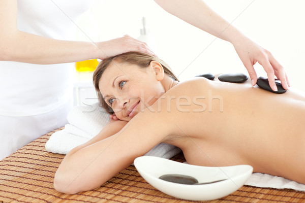 Portret radosny kobieta masażu kamienie spa Zdjęcia stock © wavebreak_media