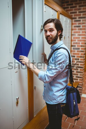 Handsome students standing up in a corridor Stock photo © wavebreak_media