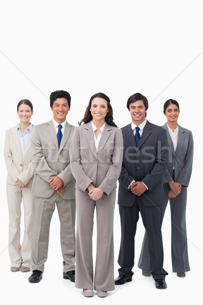 Smiling tradeswoman standing with her team against a white background Stock photo © wavebreak_media