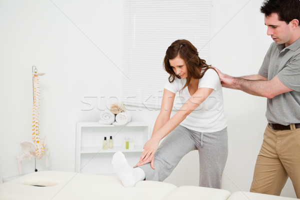 Peaceful woman stretching her body in a medical room Stock photo © wavebreak_media