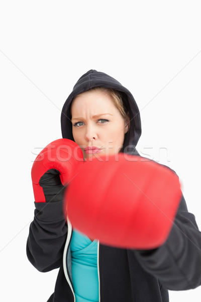 Concentrated woman boxing against white background Stock photo © wavebreak_media