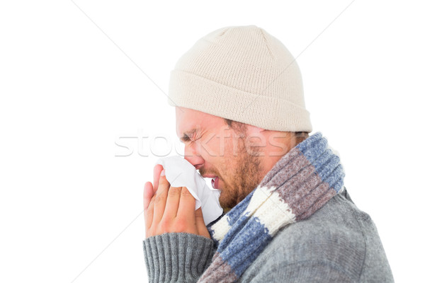 Handsome man in winter fashion blowing his nose Stock photo © wavebreak_media
