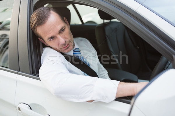 Handsome businessman smiling at camera Stock photo © wavebreak_media