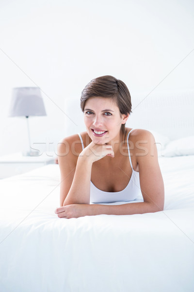 Attractive brunette smiling at camera  Stock photo © wavebreak_media