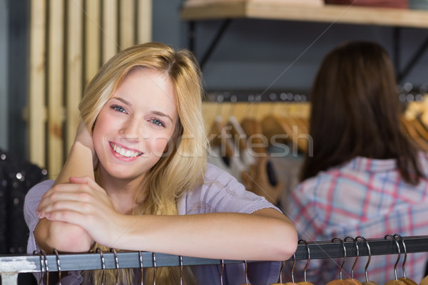 Joli femme blonde souriant caméra vêtements magasin [[stock_photo]] © wavebreak_media