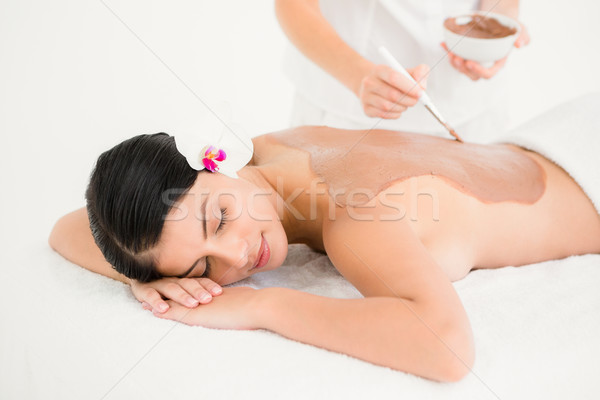 Woman lying on massage table getting mud treatment Stock photo © wavebreak_media