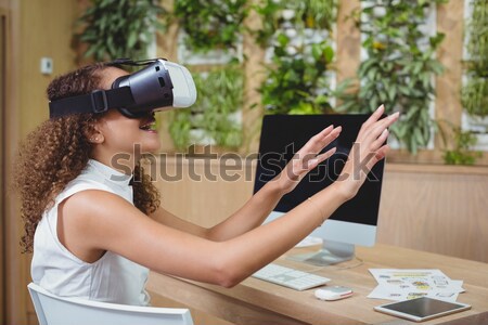 Pretty casual worker using oculus rift Stock photo © wavebreak_media