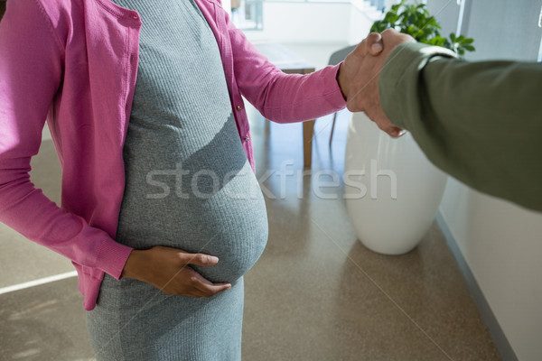 Stockfoto: Zwangere · vrouw · collega · kantoor · hand