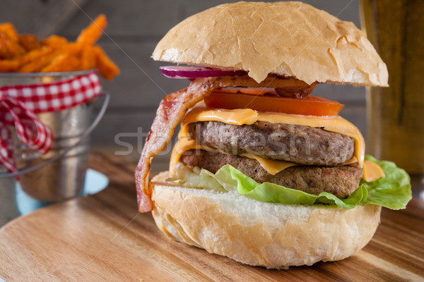 Stock photo: Hamburger and french fries on chopping board