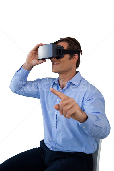Businessman pointing while wearing virtual reality simulator Stock photo © wavebreak_media