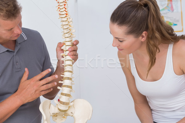 Doctor showing anatomical spine to his patient  Stock photo © wavebreak_media