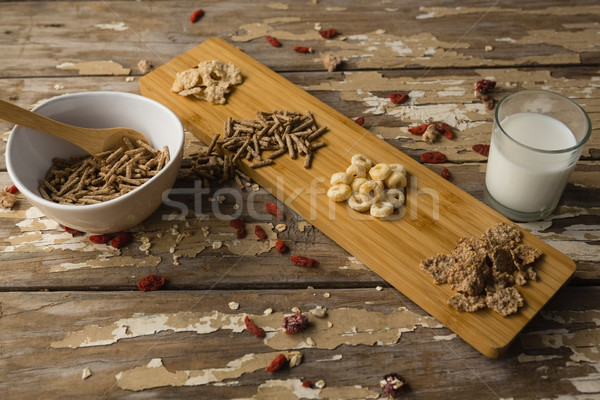 Breakfast cereals and milk on wooden table Stock photo © wavebreak_media