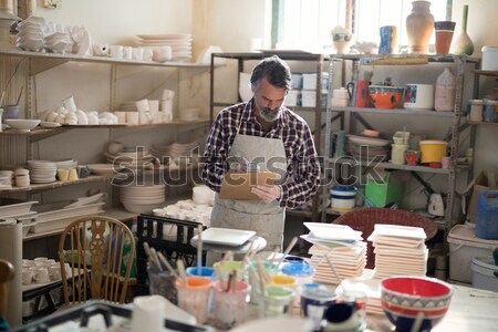 Portrait of male potter holding bowl Stock photo © wavebreak_media