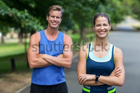 S'adapter personnes posant bras parc sport [[stock_photo]] © wavebreak_media