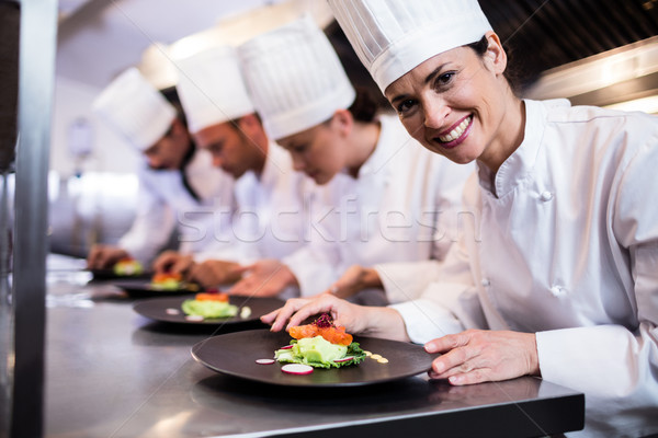 Mosolyog szakács étel tányér konyha egyéb Stock fotó © wavebreak_media