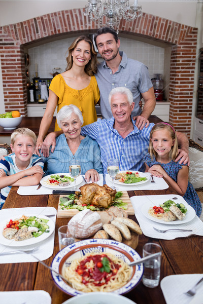 Ritratto famiglia pasto home uomo madre Foto d'archivio © wavebreak_media