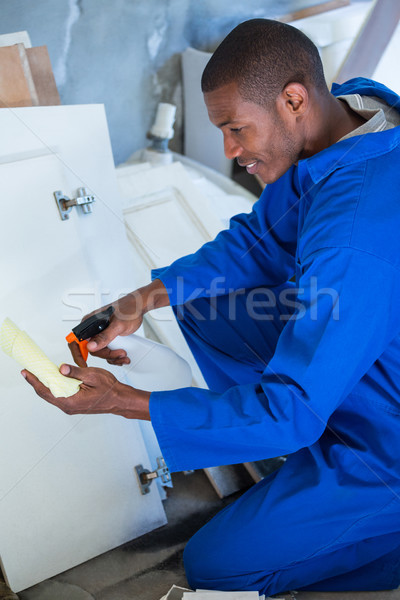 Man spraying on napkin Stock photo © wavebreak_media