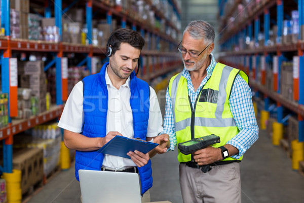 Workers colleague looking at digital tablet in warehouse Stock photo © wavebreak_media