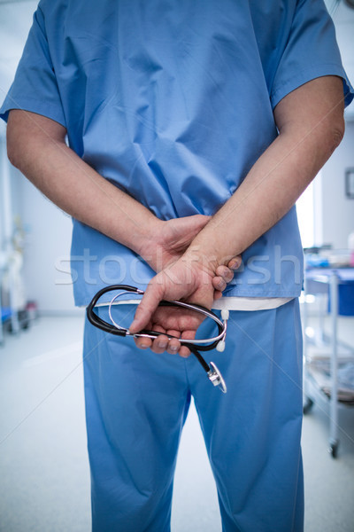 Surgeon holding stethoscope at hospital Stock photo © wavebreak_media