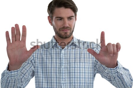 Man pretending to touch an invisible screen Stock photo © wavebreak_media