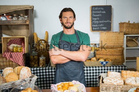 Portrait of male staff holding sweet food on board Stock photo © wavebreak_media