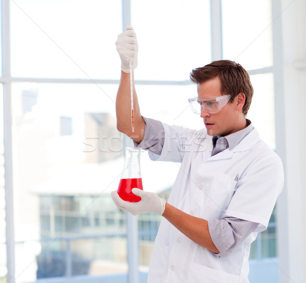 Young scientist examinig a test-tube Stock photo © wavebreak_media