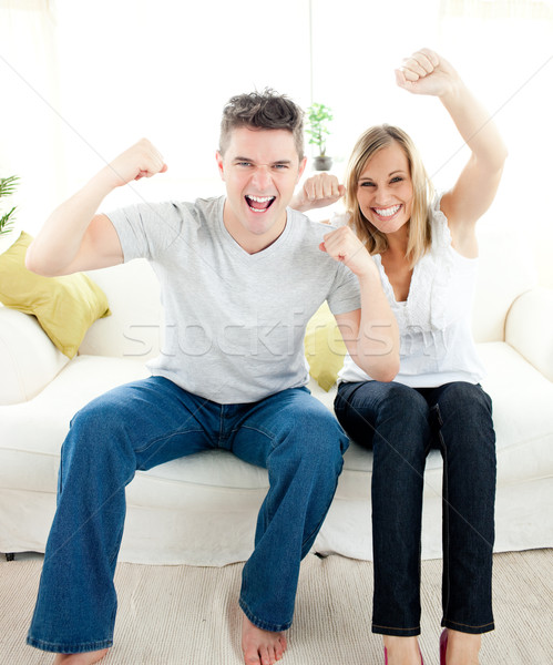 Charming couple punching the air Stock photo © wavebreak_media