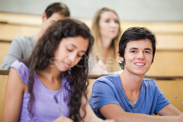 Student being distracted while his classmates are listening in an amphitheater Stock photo © wavebreak_media